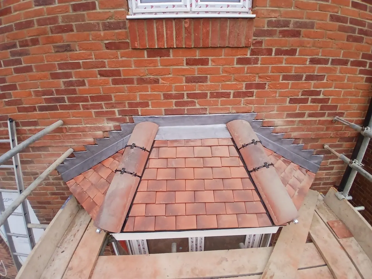 Bay window roof tiling with lead flashing and hip tiles, Bracknell