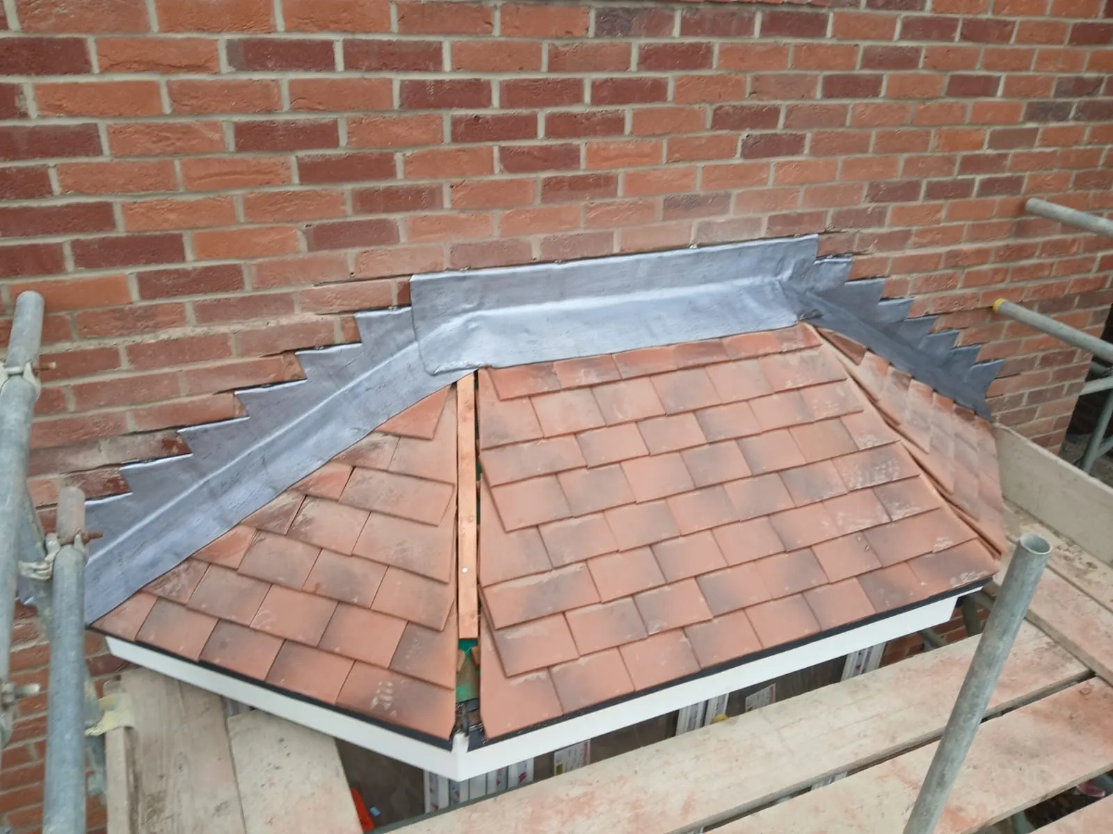 Bay roof retiled in clay tiles with new lead flashing in Bracknell