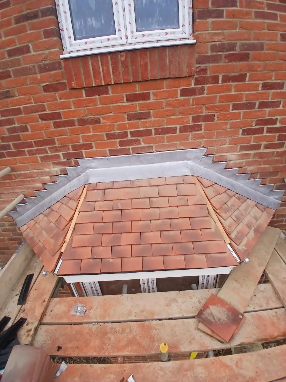 Bay roof tiling and lead flashing in progress in Bracknell