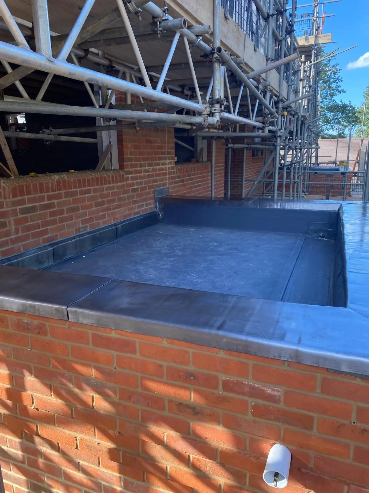 Parapet wall lead capping above brickwork, Bracknell